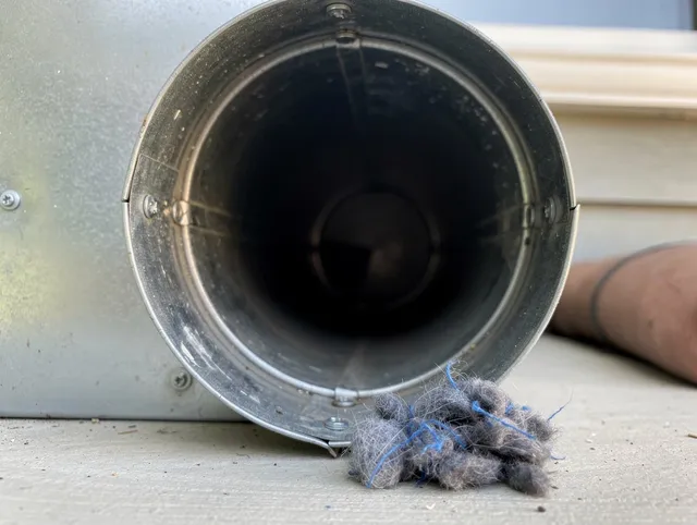 Hollywood Dryer Vent Cleaning technician using specialized equipment to clear severe dryer vent blockage in Hollywood